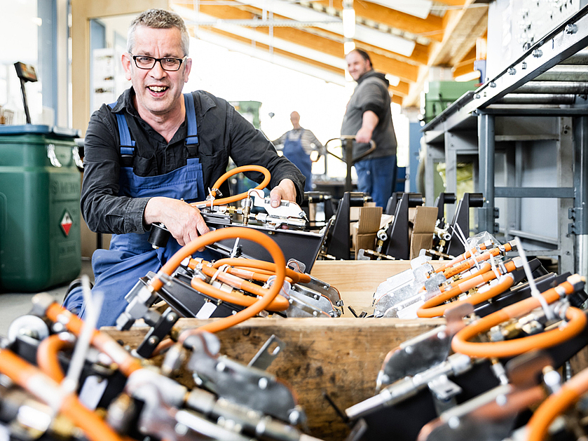 drei Männer der Werkstatt Afferde bei der Arbeit