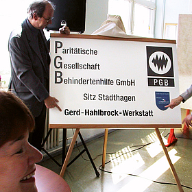 zwei Personen halten einen Vortrag über die PGB und die GHW